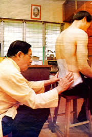  Master Chee administering a treatment in his surgery